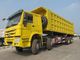 SINOTRUK Howo 8×4のisuzuのダンプ トラックは70トン30CBMダンプ箱モデルZZ3317N4667Aに荷を積みます
